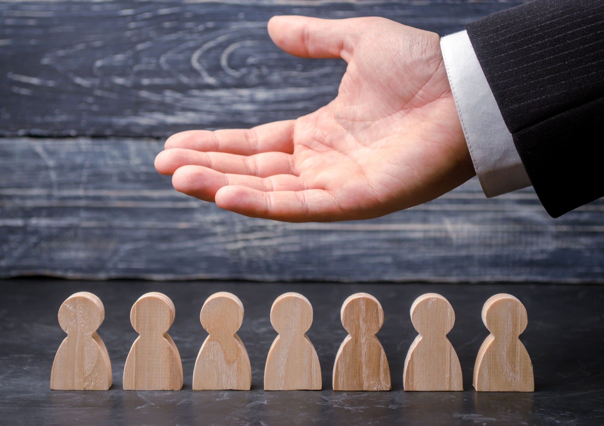 Leader (CEO) represents the team. Human resources. Businessman and working staff. Care for employees. Labor union. Life insurance. Employment agencies. Marketing segmentation concepts.